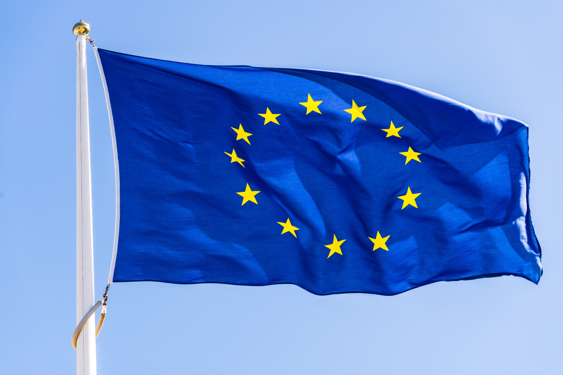 European Union flag flying against a clear blue sky